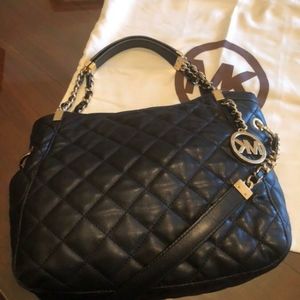 Michael Kors purse, leather. Purse has 4 inside pockets for phone,  and keys